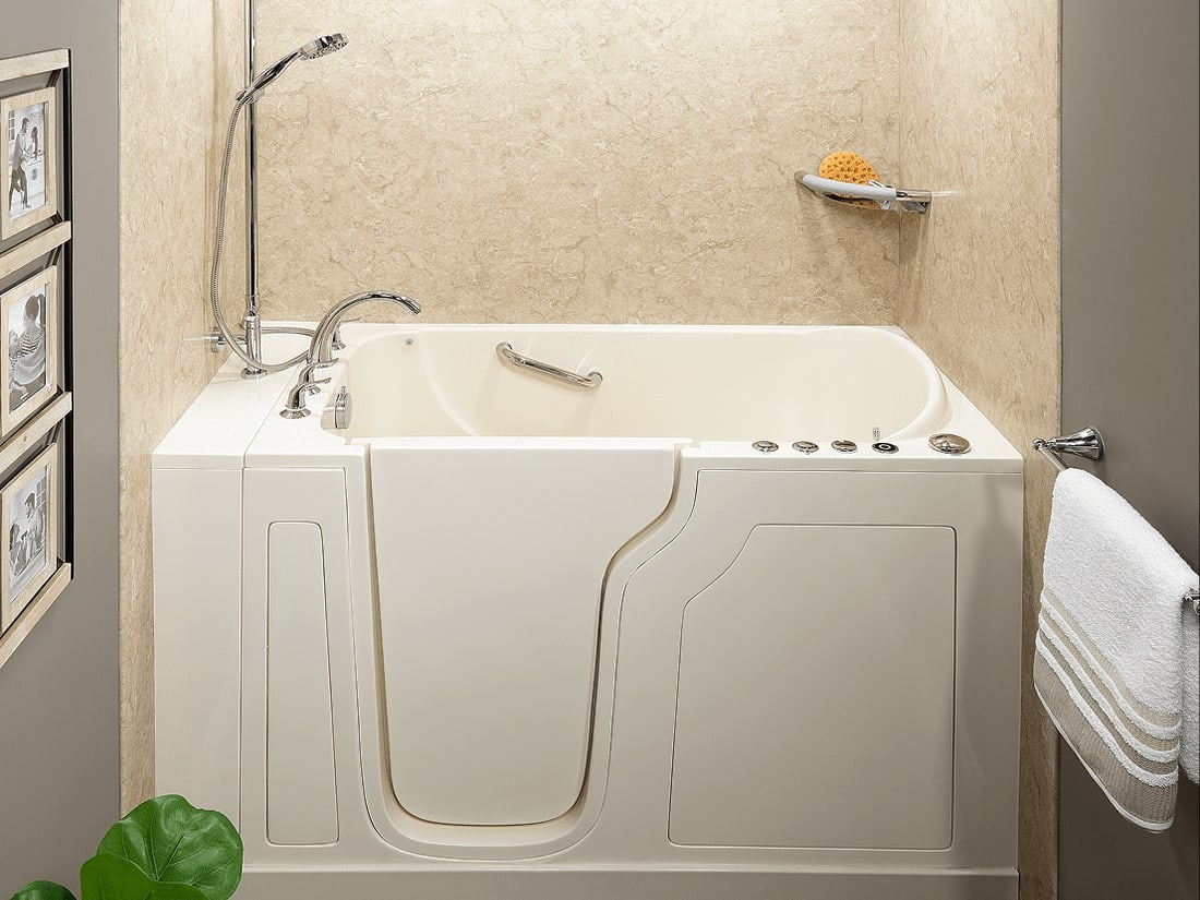 Walk-in bathtub with a handheld shower and grab bar